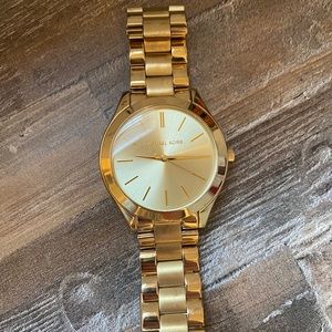 Women’s gold Michael Kors watch